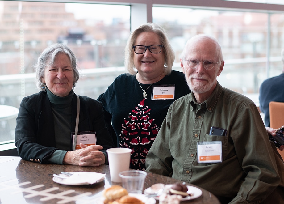 3 UT retirees pose for a photo during the annual holiday party