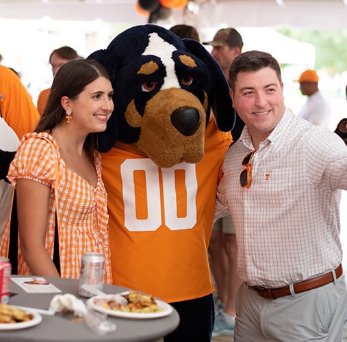 A man and woman pose with Smokey