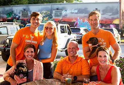 Alumni pose for a photo during a Vol Watch Party