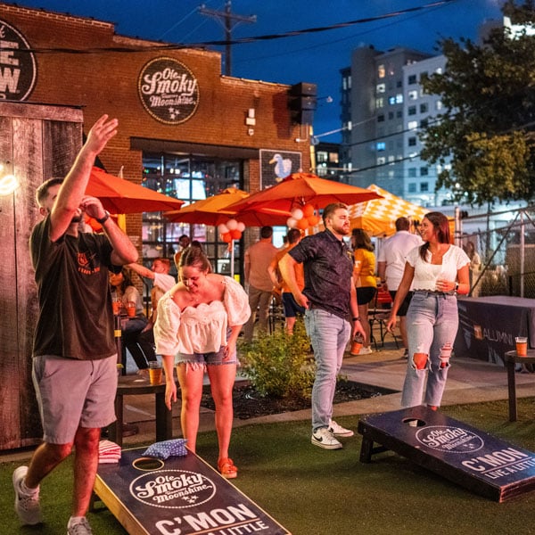 Young alumni play cornhole during a Vols in the City event in Nashville