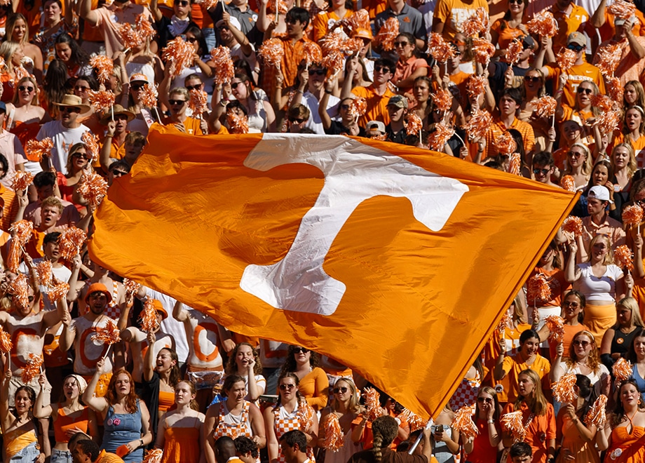 Power T flag in a crowd of UT fans wearing orange