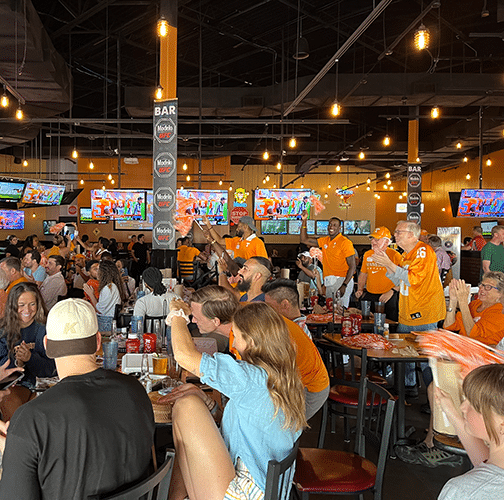 Tennessee Vol fans watch a football game in a local restaurant