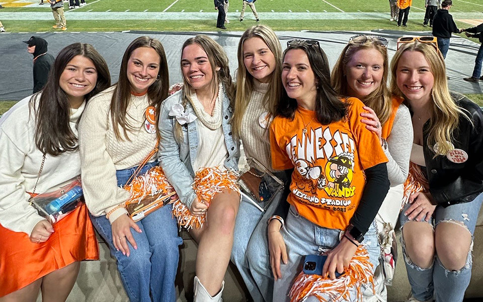 Kayla Hzozdovic with a group of friends in Neyland Stadium