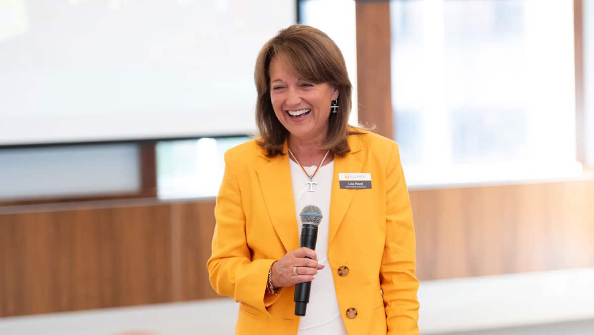 Lisa Reed smiles as she addresses the Alumni Board of Directors