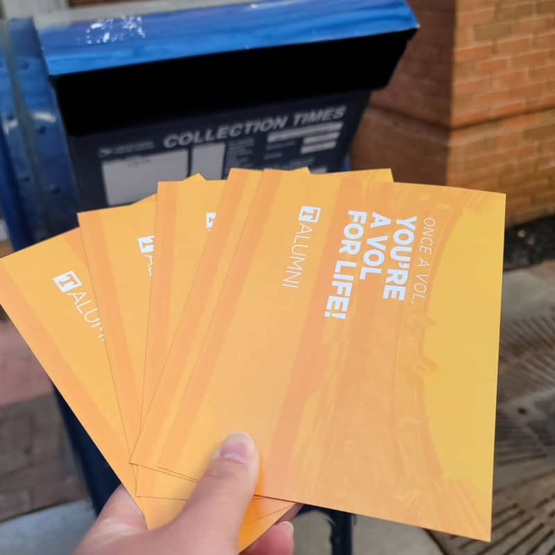 welcome-a-vol-delivery-800x800 Welcome-A-Vol postcards being put into a mailbox.