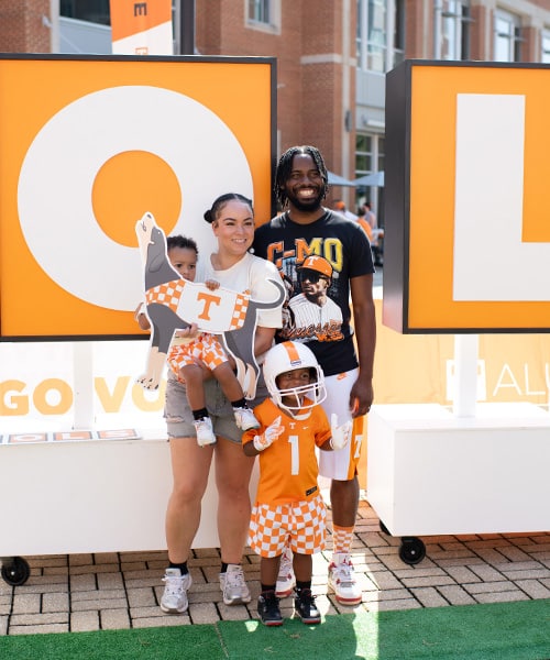 homecoming-tailgate-family A family poses for a photo in front of the V-O-L-S letters during the Homecoming tailgate.