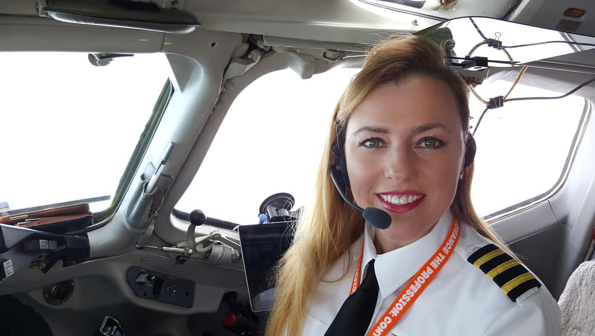 Katrina Vieten in the cockpit of an airplane.