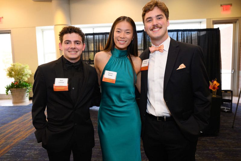 phelps-tatiana-classmates-800x533 Tatiana Phelps, center, poses with fellow students during a formal alumni event.