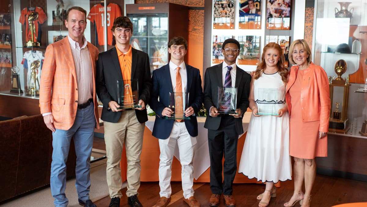 Peyton Manning and Chancellor Donde Plowman with the 2025 Peyton Manning Scholars.