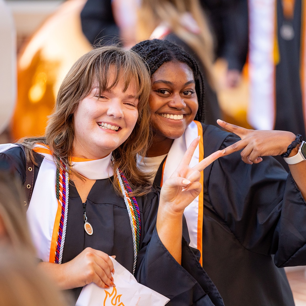 20260513_Torch_Night_F_SB_0456 two students smiling at UT graduation