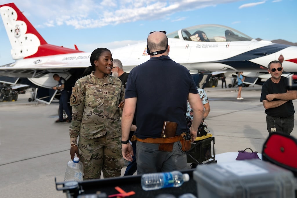 Jasmine Manning on Air Force Base with planes in the background