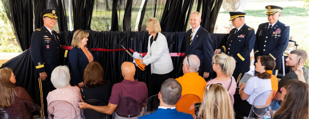 Chancellor Plowman cutting the ribbon at the new memorial